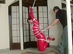 Bondage In Straigh Latex Catsuit And Ball Gag
