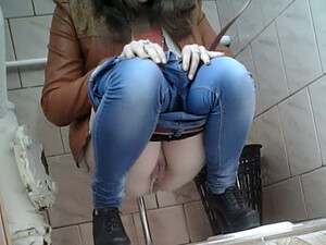 Slender Girl In Very Tight Blue Jeans Filmed In The Toilet Room