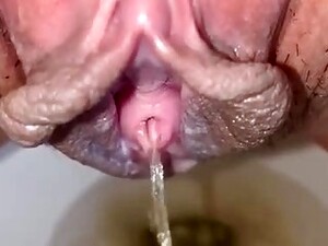 Mouth- Watering Close- Up Of A Shaved, Asian Pussy While Peeing In A Public Toilet